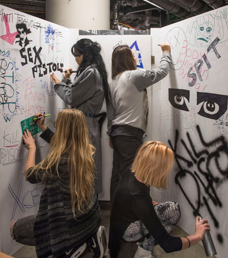 Students from Central Saint Martins decorate punk display.