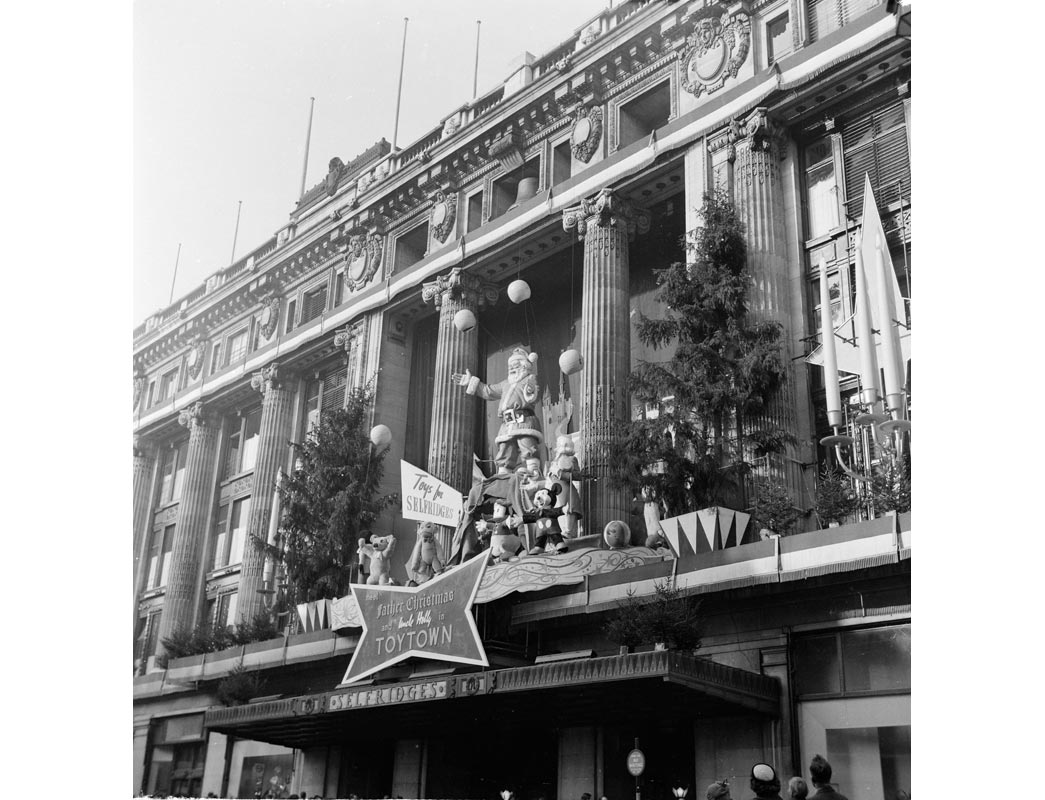 The exterior Christmas display at Selfridges in December 1953. Extravagant and elaborate window and exterior displays at Christmas time and during Royal celebrations have been a tradition at Selfridges since the founder Henry Selfridge first lit the shop windows at night for passers by to see goods on sale in 1890. 
