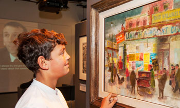 A child looks at a modern artwork during visit to the Galleries of Modern London.