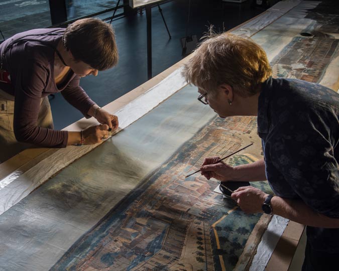 Museum of London conservators work to restore the Prevost panorama.