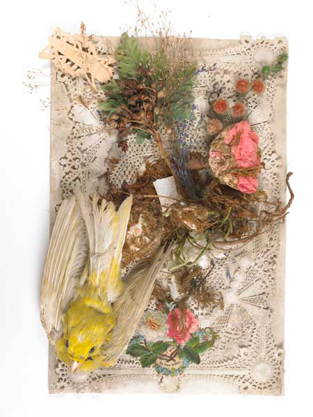 Handfinished valentine's card stored within an original card box, without lid. The card comprises a top sheet of uncoloured lace paper decorated with an applied stuffed canary 