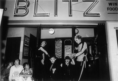 Group of young clubbers outside The Blitz club, Covent Garden. The Club is widely regarded as being the birth place of the New Romantics in the early 1980s and those who frequented it were known as 'Blitz Kids'. This photograph is thought to have been made on the closing night of the club in September 1981.
