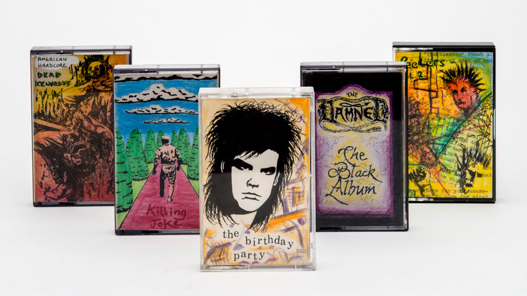 Home-decorated cassette tapes of punk bands, created by Luke Blair.