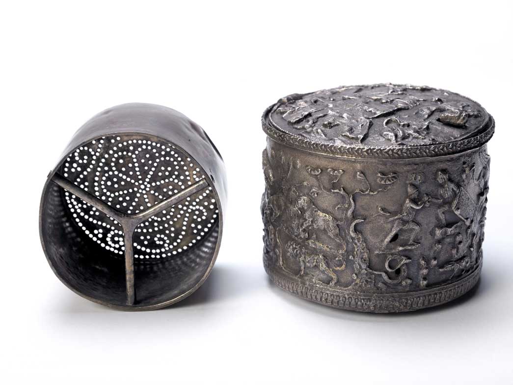 Roman silver box and strainer. It may have been associated with an initiation ceremony. This is one of the most mysterious finding from the temple of MIthras. It was found after the removal of a 19th century foundation cut into the north wall of the temple. Its porpose is uncertain and the symbolism of the figures of men and animals on the box is obscure. It may be connected with the idea of death and re-birth associated with an initiation ceremony.
