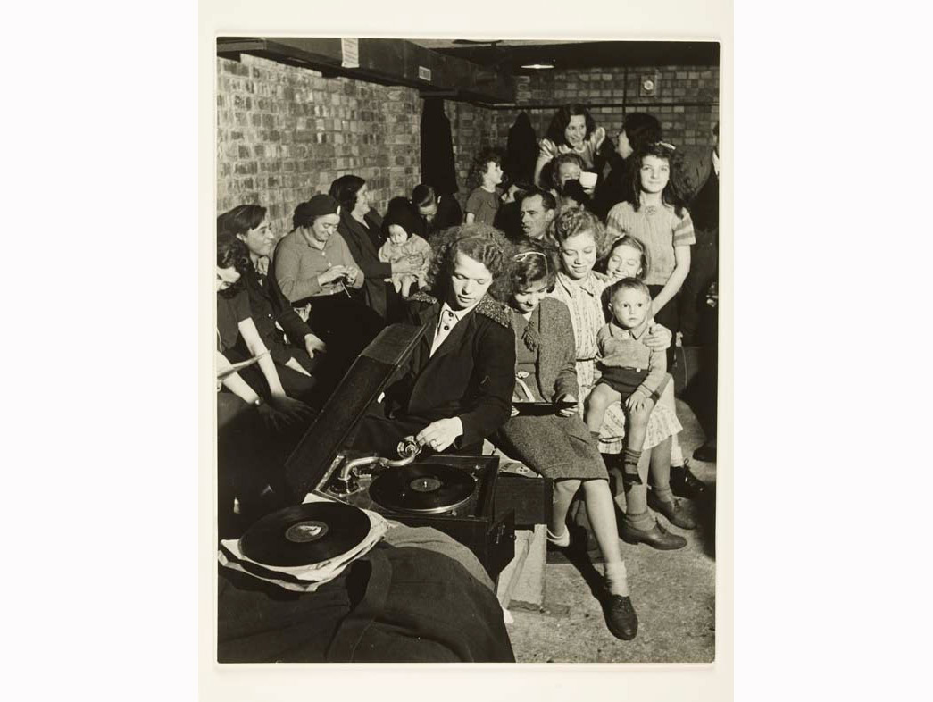 Following the onset of the Blitz in September 1940, thousands of Londoners began to use Tube stations as impromptu air-raid shelters. Although the idea of Londoners sheltering in Tube stations has subsequently become symbolic of Home Front resilience, in fact only 5% of Londoners used the underground systems in this way. 