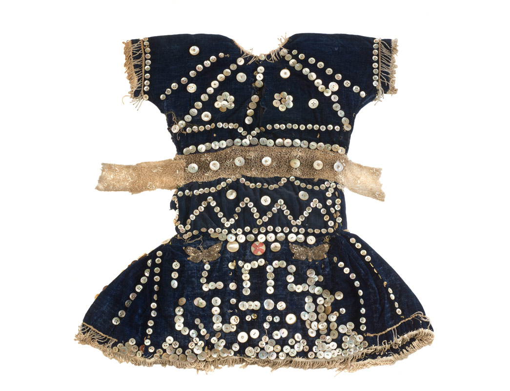 Pearly dress for a child, with Little Queenie written on in sequins.