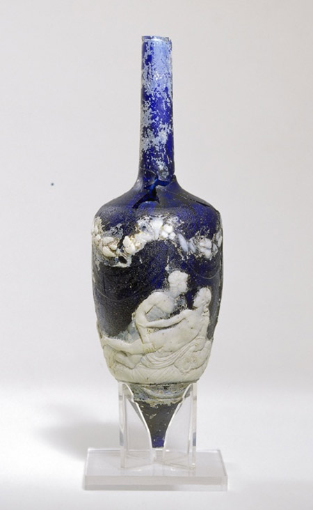 Perfume bottle made of cameo glass found in the Roman necropolis of Ostippo (Spain). From 1st century BC or AD. Side B of the bottle, portrayed above, shows two young men in bed. Side A, not portrayed, shows a man and a woman.
