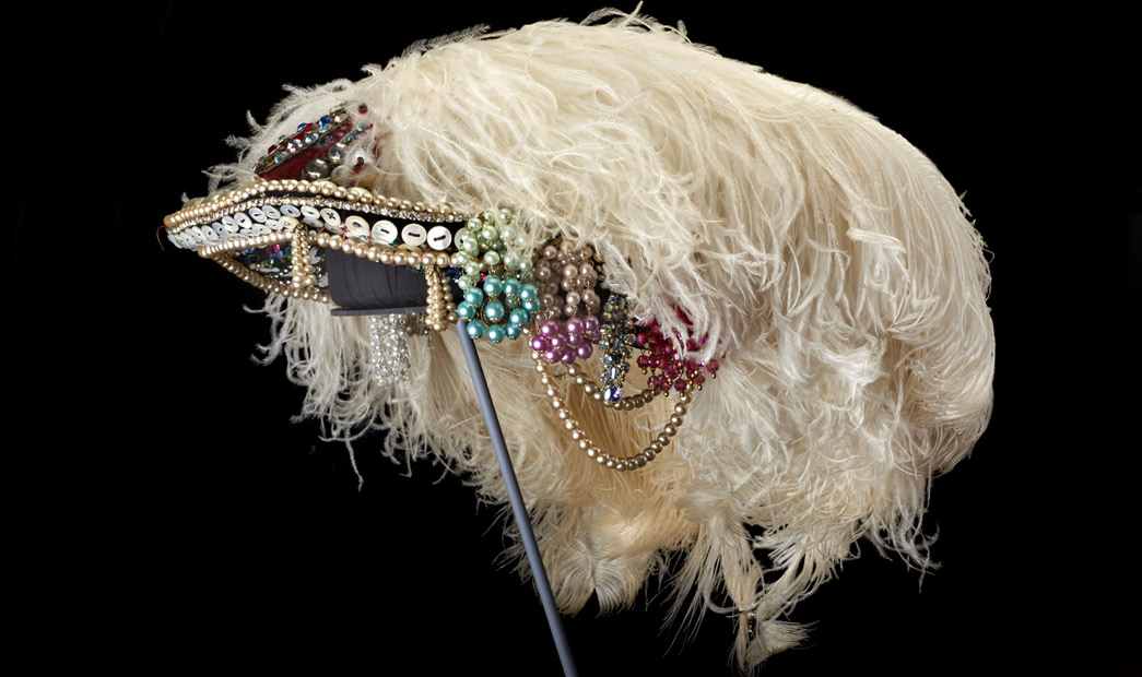 A Pearly hat decorated with ostrich feathers.