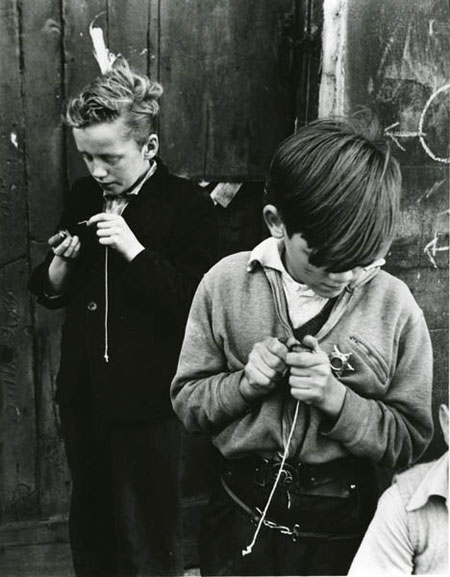 Two boys playing conkers in Addison Place, Notting Hill
Roger Mayne, 1957

