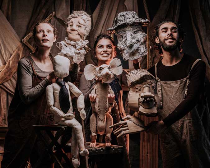 Three members of Moth Physical Theatre hold the puppets created for Meet the Real EastEnders