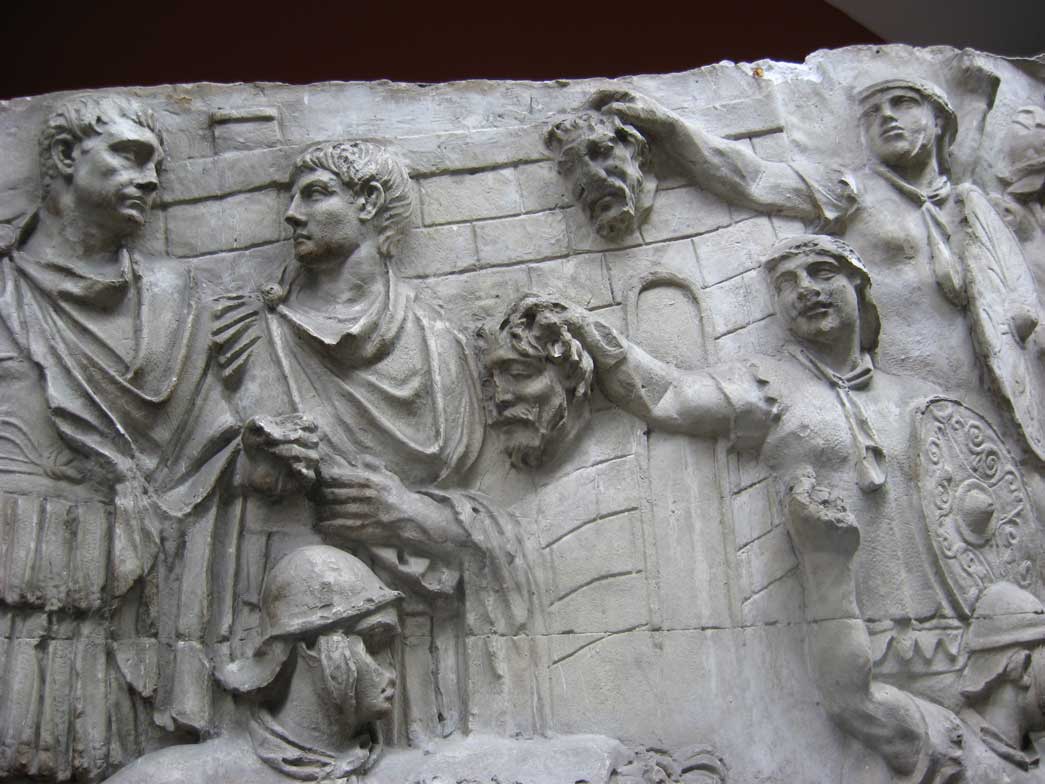 Showing scenes of headhunting by the Roman military.