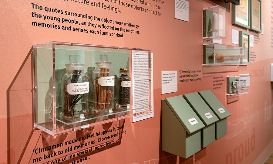 The interior of the Holding Emotions display at Museum of London Docklands, showing samples of goods imported through the docks
