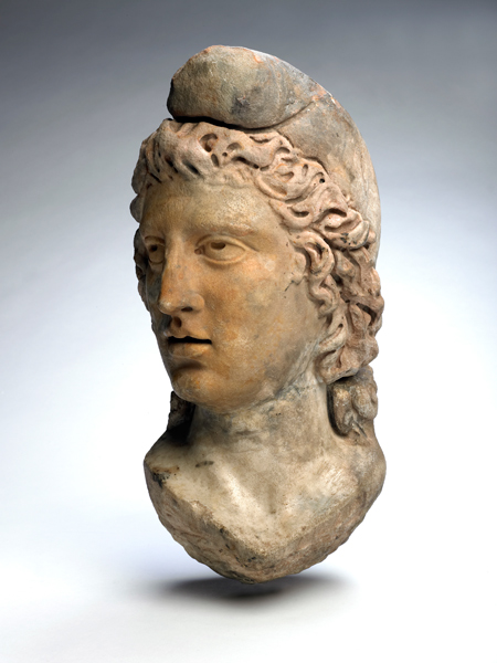 Statue head of God Mithras. This statue head was found buried in the Mithraeum floor at Bucklersbury House, Walbrook in 1954. 
