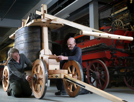 Crofords Coachbuilders assemble the fire engine at Mortimer Wheeler House.