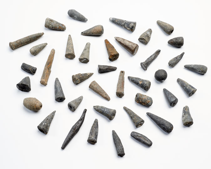 A collection of 15th-century lead fishing weights found on the Thames foreshore at Brook’s Wharf, City of London. Many of them were mass-produced in moulds and may have been from sea-fishing nets.