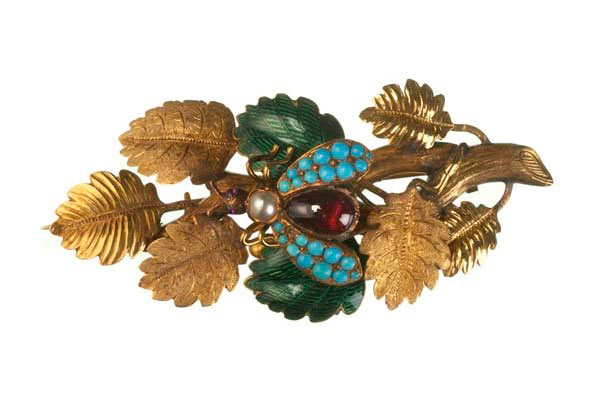 Gold brooch, chased and textured to resemble a leafy branch