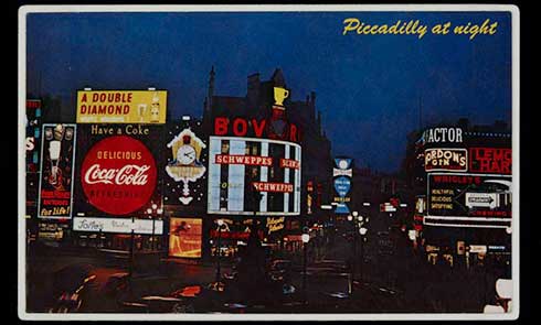 Postcard with a 1960s view of Piccadilly Circus at night