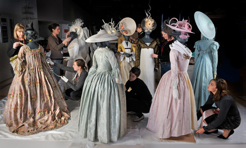 Curators prepare costumes for display in the Vauxhall Pleasure Gardens display.
