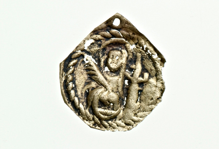 Devotional badge of St Barbara, who gave protection against sudden death. St Barbara is depicted holding a palm branch over her right shoulder