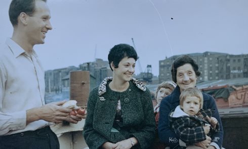 A 1965 photo with Susan (in her nan's lap) on a family trip on her dad's tug with Powell’s Wharf behind them (Courtesy Susan Winterbourne)