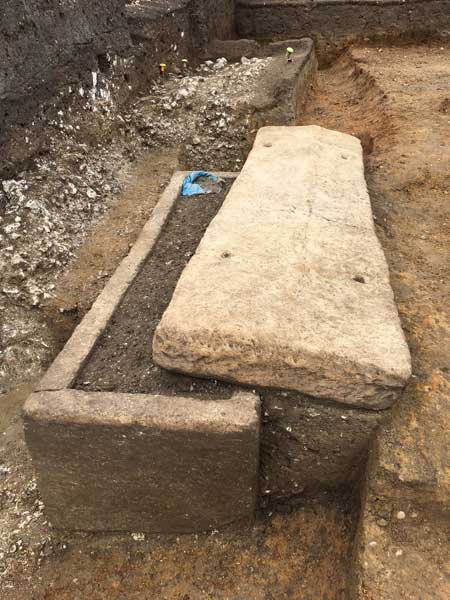 Roman sarcophagus being excavated in Southwark, now on display in Roman Dead.