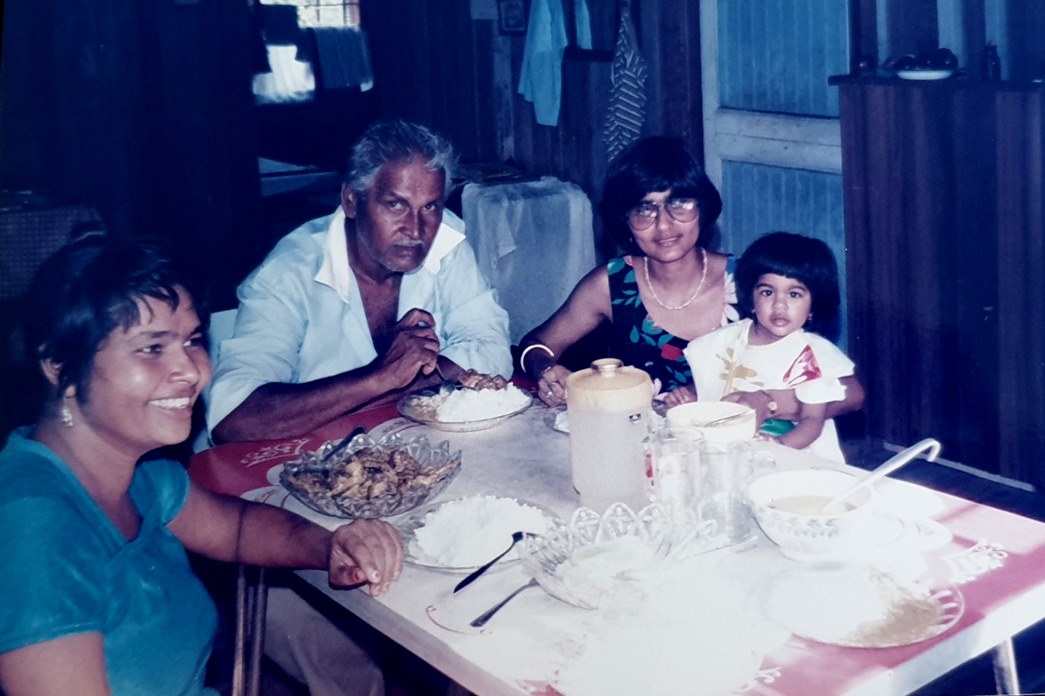 Guyanese chicken curry meal with family
A young Kumal (extreme right) with her great uncle and aunt in Guyana, 1986, eating chicken curry. (Courtesy Shamal Kumal)
