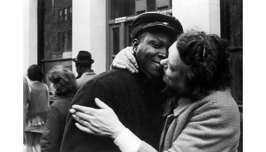A black man and a white woman embracing outside the Piss House Pub in Portobello Road, Notting Hill, 1968.

