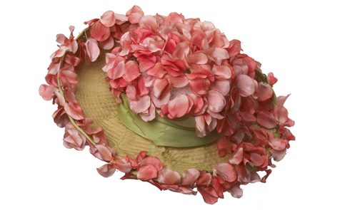 detailed, hand-assembled flowers were used to decorate dresses, bonnets and hats, several of which are included in the display