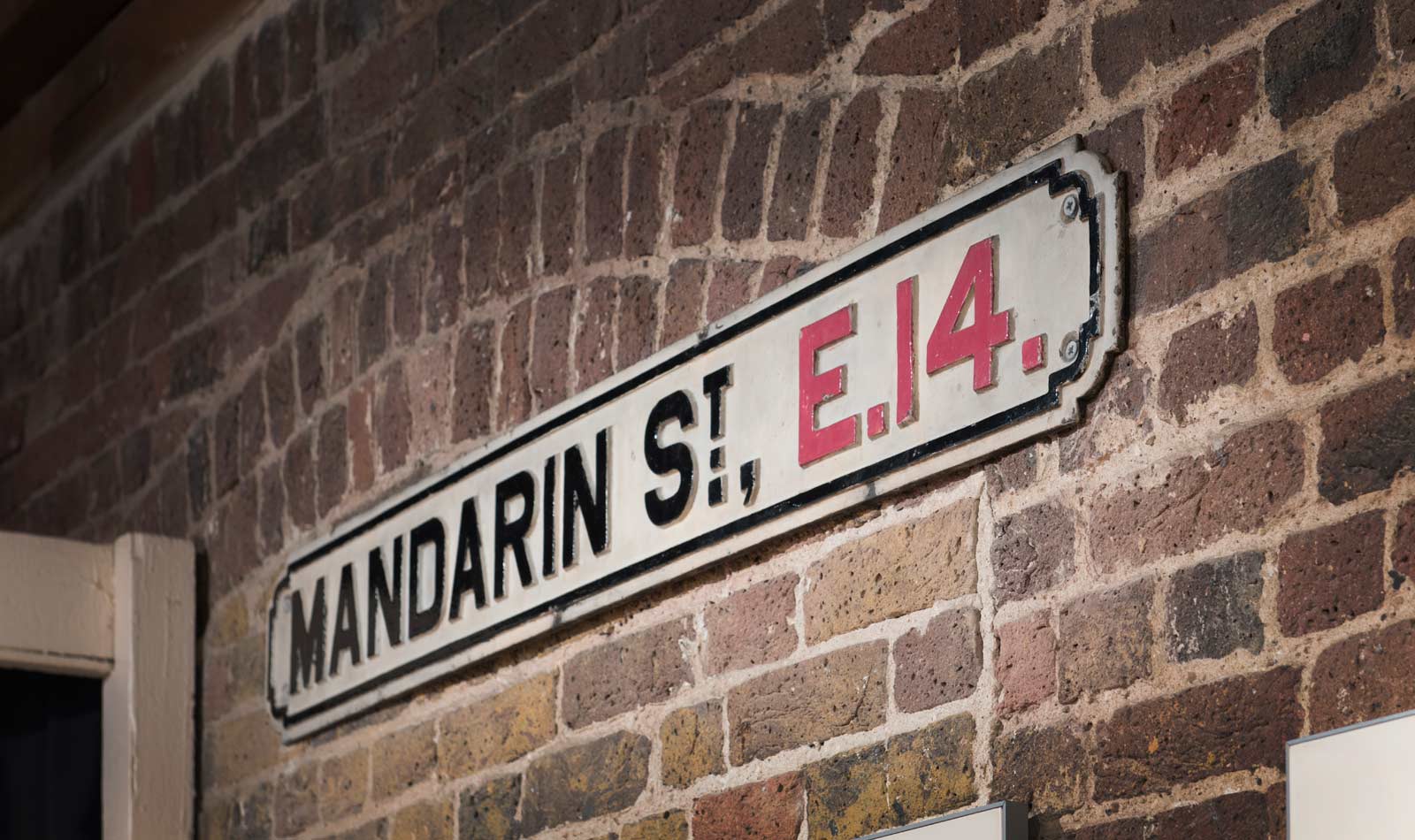 Street sign reading Mandarin Street, on display in the Museum of London Docklands.