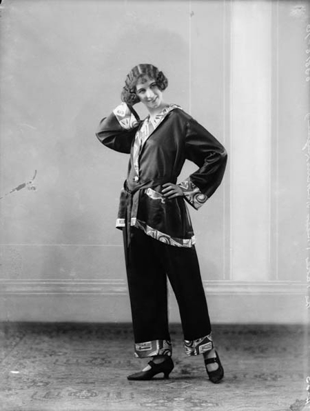 A photograph by Bassano Ltd. of a woman modelling pyjamas for Harrods.