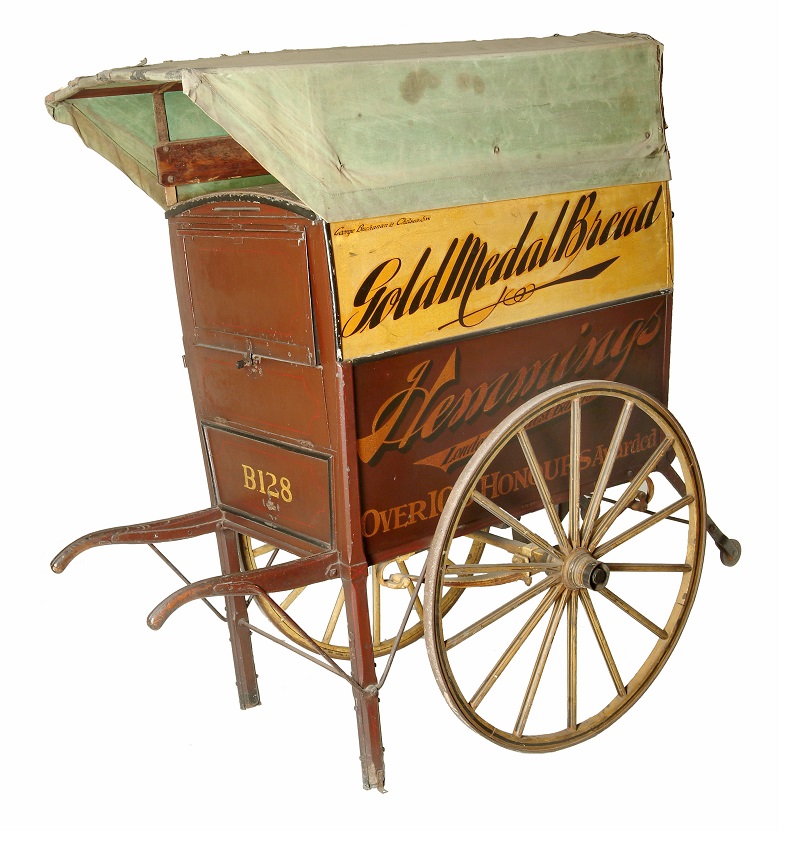 Two-wheeled, wooden baker’s handcart made by Buchanans of Radnor Walk, Chelsea. Used throughout the 1920s and 1930s to delivery bread and cakes.  