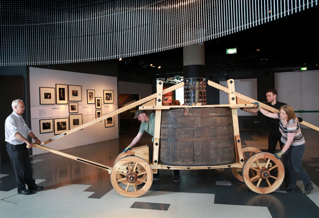 Museum of London conservators install a reconstructed 17th century fire engine.