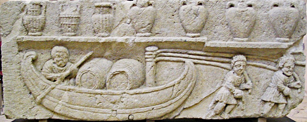 Stone sculpture from France, probably part of a wine merchant’s tombstone, showing barrels on a river boat. On the shelf above are Gauloise amphorae. (Courtesy: Wikimedia Commons)