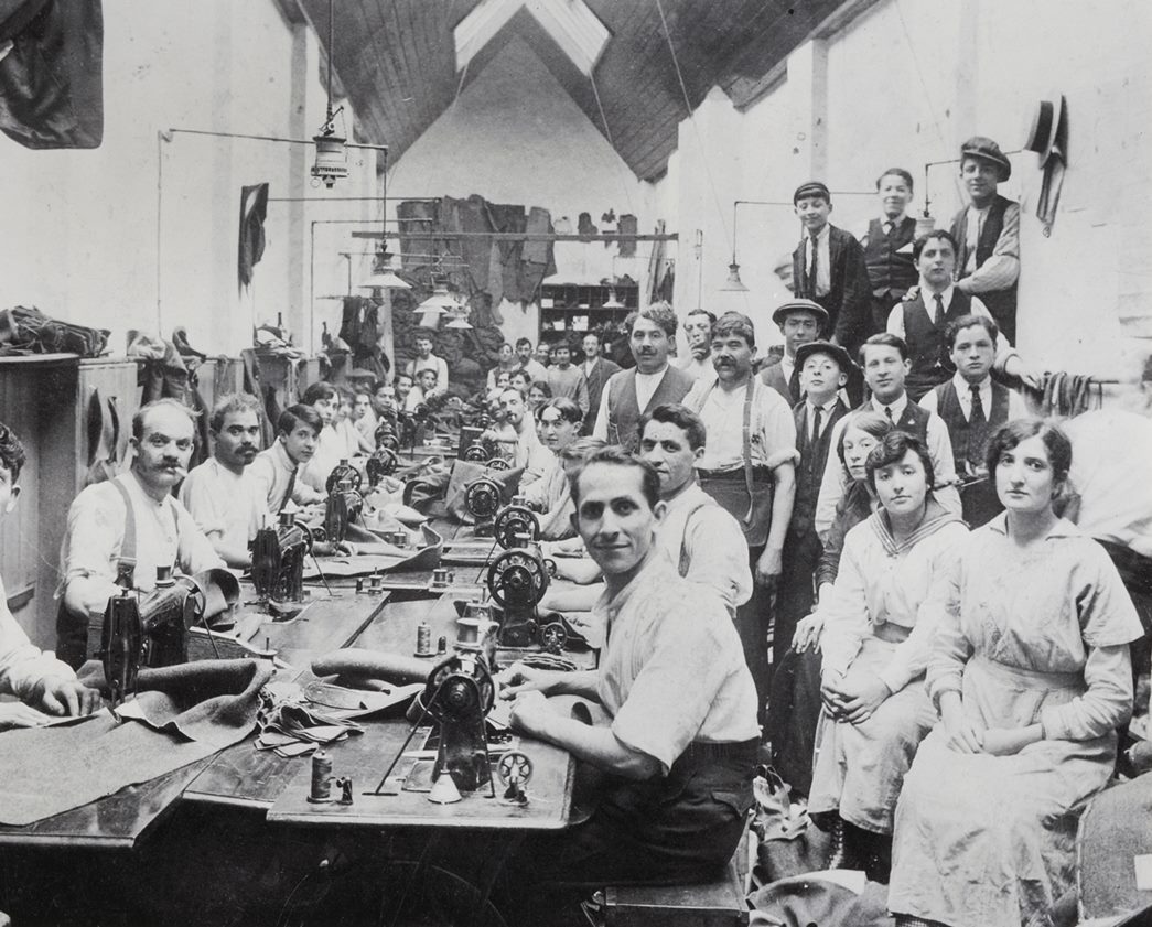 Schneiders Garment Factory, Durward Street, Stepney, c1917
Workers operating in cramped conditions at a clothing factory in Stepney owned by the Jewish Schneider family. (ID no.: IN3853)
