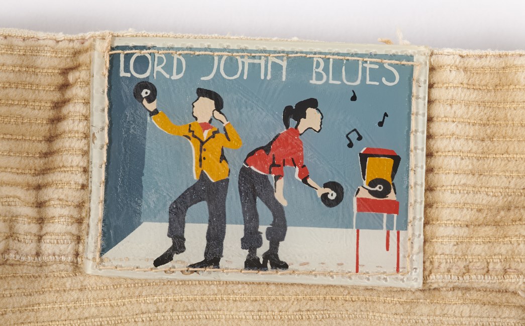 Lord John trouser label 
Lord John’s musical connections are best seen on the label of this pair of 1970s corduroy flared trousers. (ID no.: 84.31/2)

