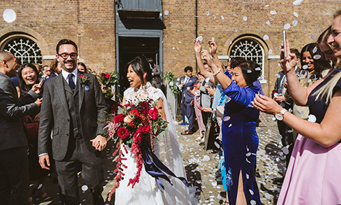 A wedding happening between two people at Museum of London Docklands