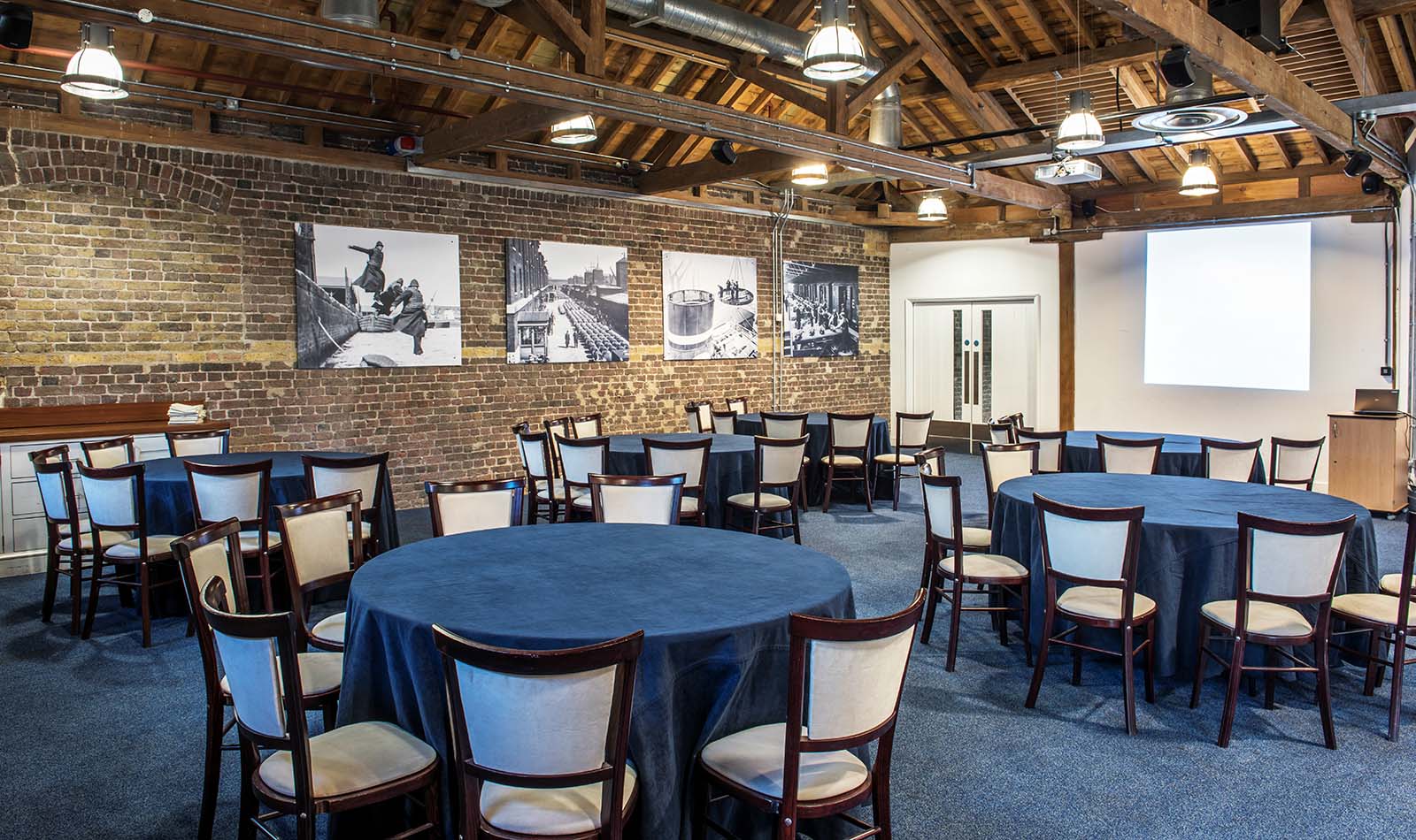 Quayside room in a cabaret layout, as part of the Museum of London Docklands' venue hire offer