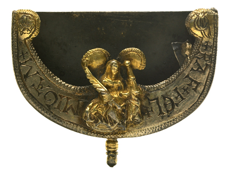 This silver-gilt chape (protective cap for a belt-end) bears a cast-relief figure of St Barbara