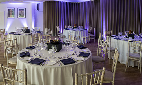 Tables set up in the garden room ready for lunch – part of the venue hire offer at Museum of London, London Wall