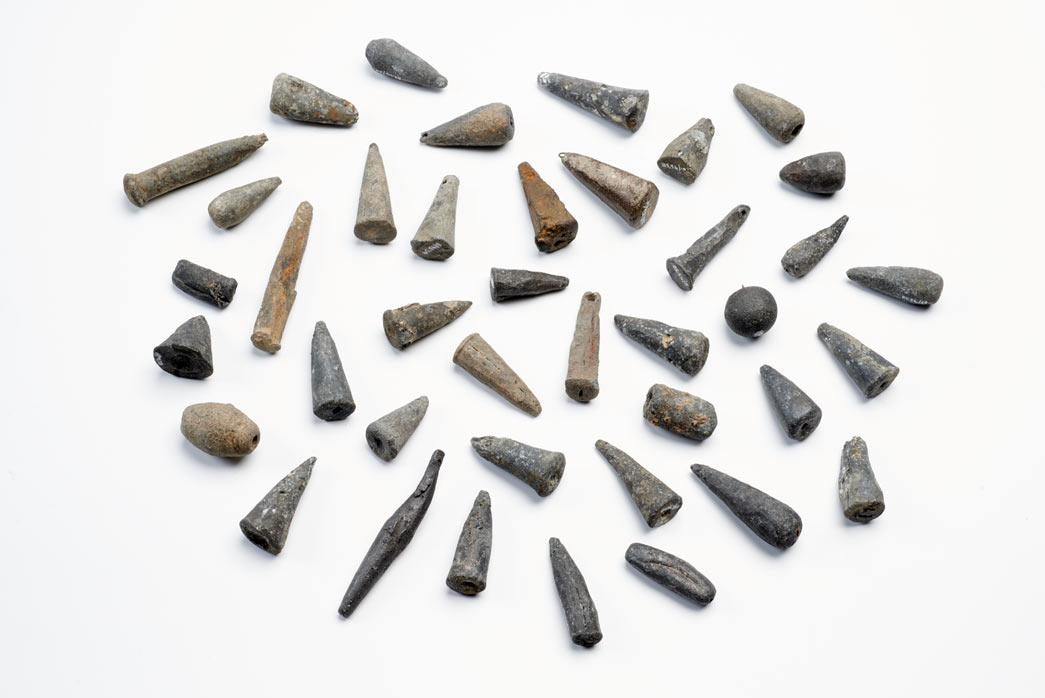 A collection of 15th-century lead fishing weights found on the Thames foreshore at Brook’s Wharf, City of London. Many of them were mass-produced in moulds and may have been from sea-fishing nets.