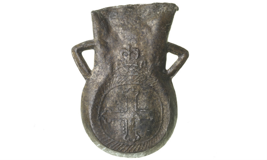 St Thomas Becket. Ampulla decorated with Lombardic 'T