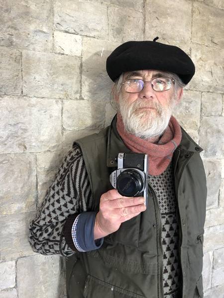 Phil Polglaze with his Pentax camera, March 2023.