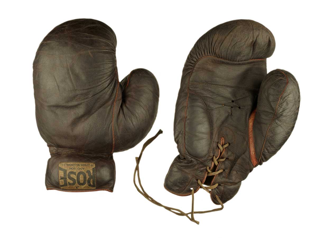 Brown leather boxing gloves with lacing and maker's label, 'Rose', sewn on the cuff.