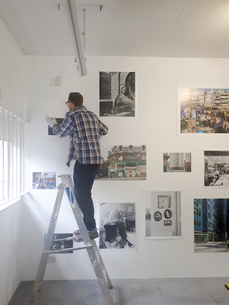 Putting up pictures for the final hang in the Magnum Live Lab.