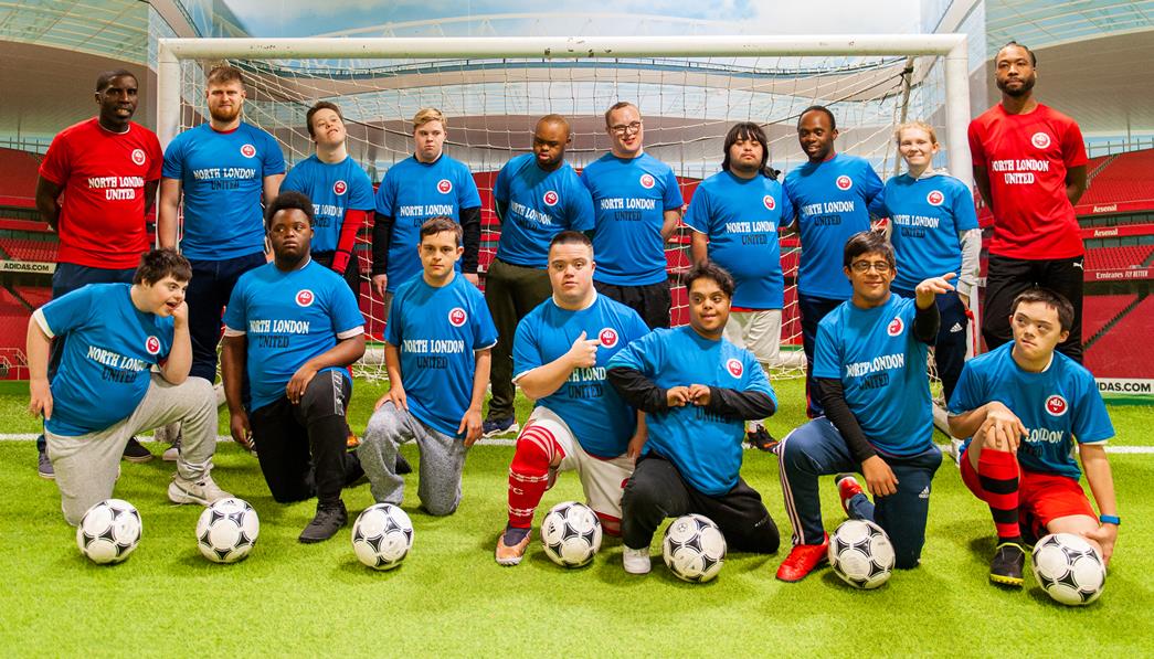 Coach H (left) and Coach Mykel Maynard, with NLU members, have the faith that with the right support, they can achieve many goals – on the pitch and in life. 