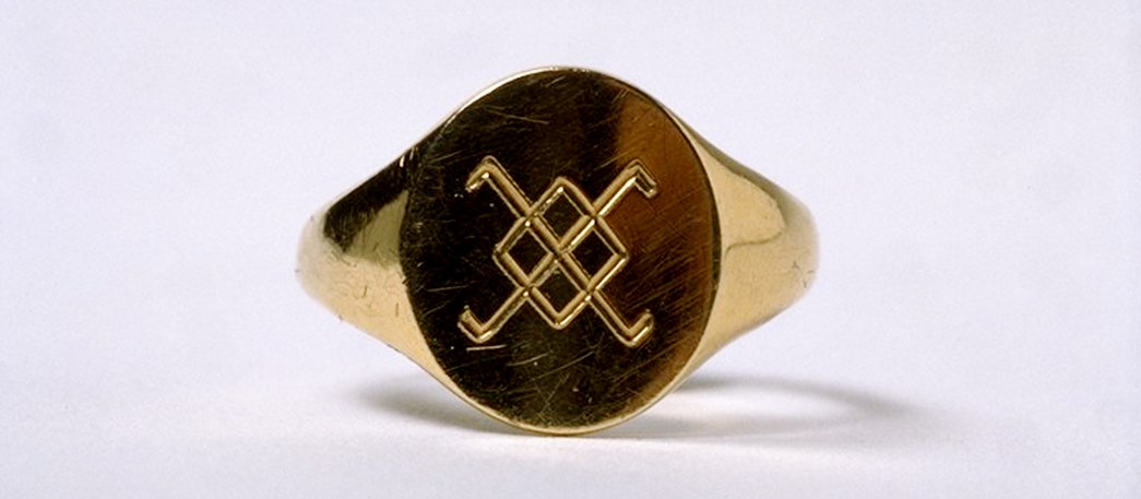 This gold finger ring is one of a group of 12, designed for members of the lesbian group Kenric. “In 1968 the Kenric rings were struck to provide a silent recognition between members: secrecy became style, fashion concealed discretion.” Read more here. (ID no.: 2000.77)
