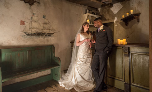 Bride and Groom pose in the Museum of London Docklands