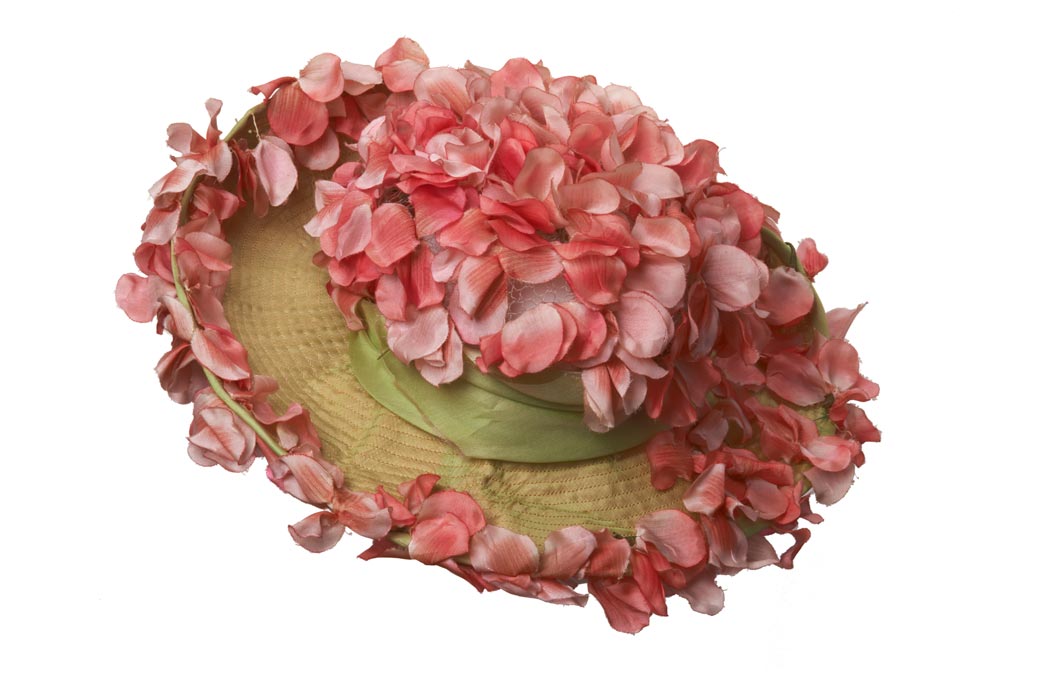 Back view of a hat decorated with artificial flowers.