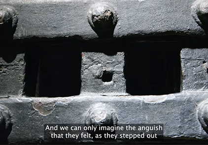 A close-up shot of the Newgate Prison door