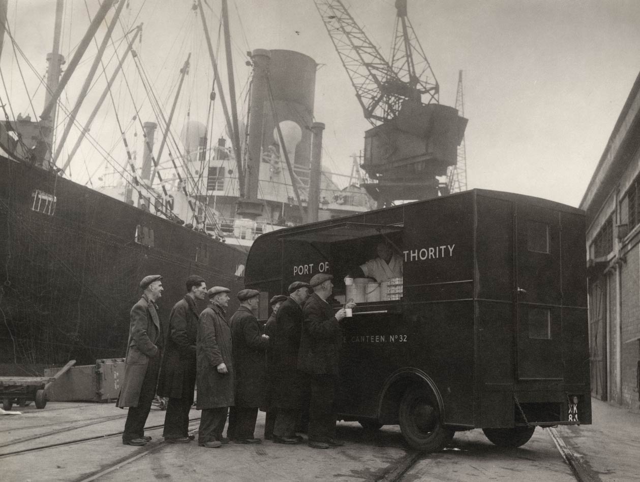 Photograph of mobile canteen dispensing food on the London docks during WWII, copyright PLA Archive/Museum of London.
